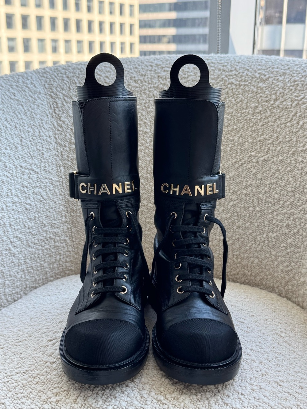 CHANEL Black Leather Combat Boots with Gold Logo Strap